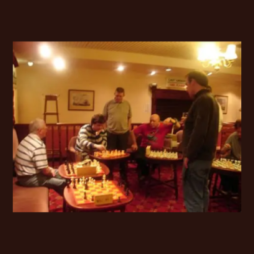 Group of people playing chess