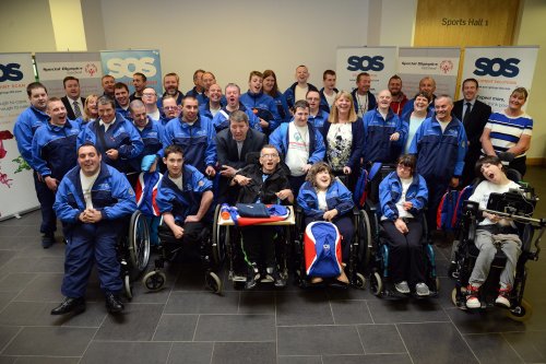 Group of athletes posing for a photograph in their uniforms.