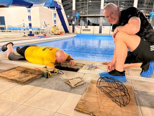 Volunteers doing work around the pool