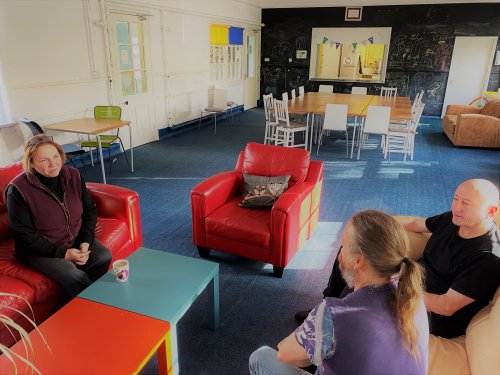 Staff seated on sofas in Parker Hall