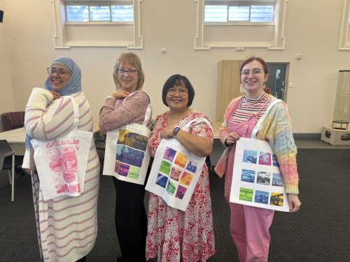 Group image of four women showing off tote bags which have been created in the MakerPlace 
