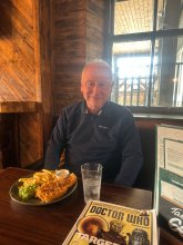 A picture of one of our clients enjoying a rare pub lunch on a day trip out.