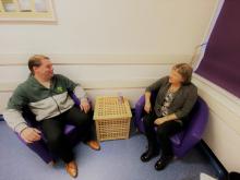 Staff talking in small meeting room