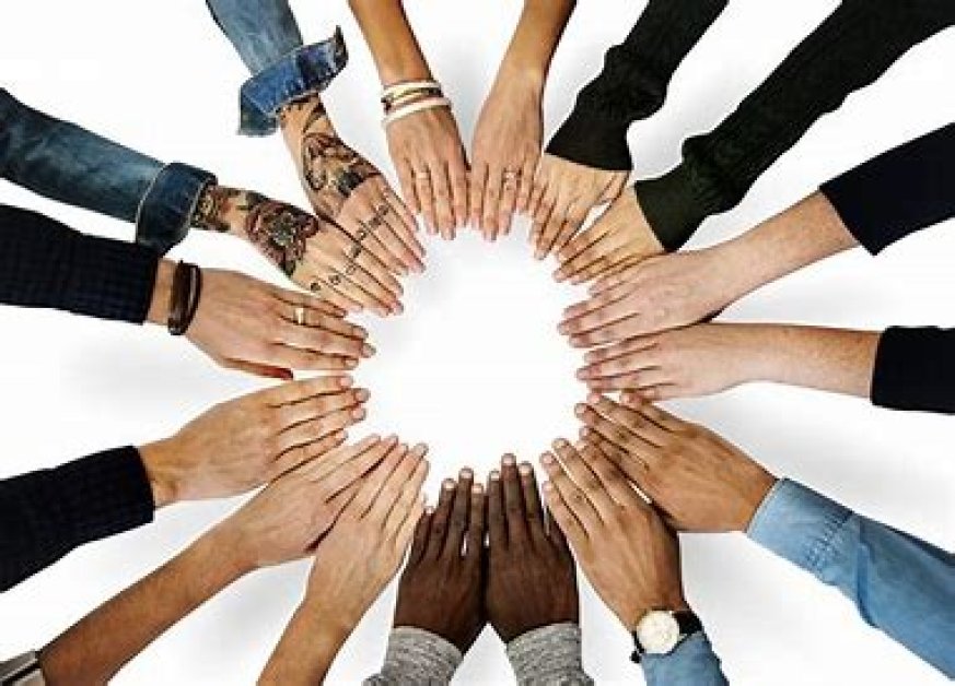 Image of eight people from diverse backgrouds, making a circle with their hands