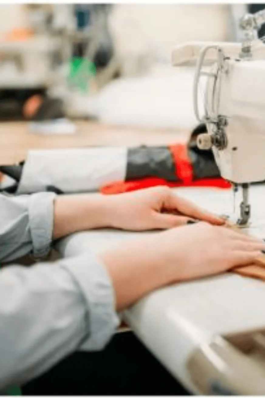 Hands on a sewing machine