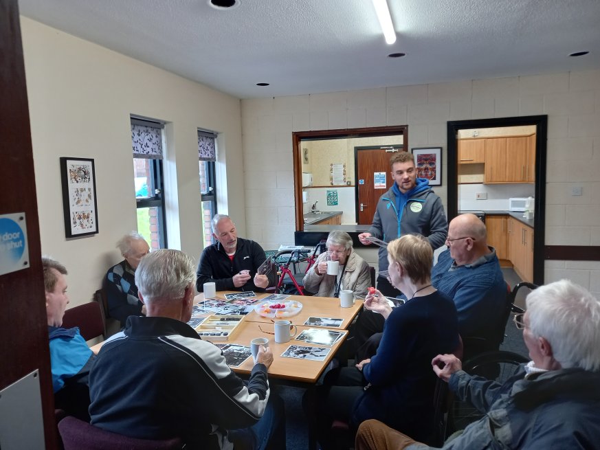 Group members sitting around table 