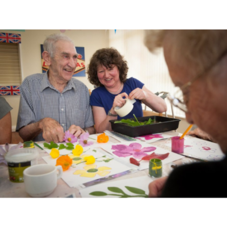 Man and woman taking part in visual arts workshops