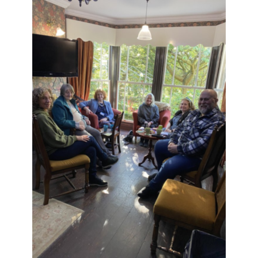 A picture of a group of people sitting with coffee