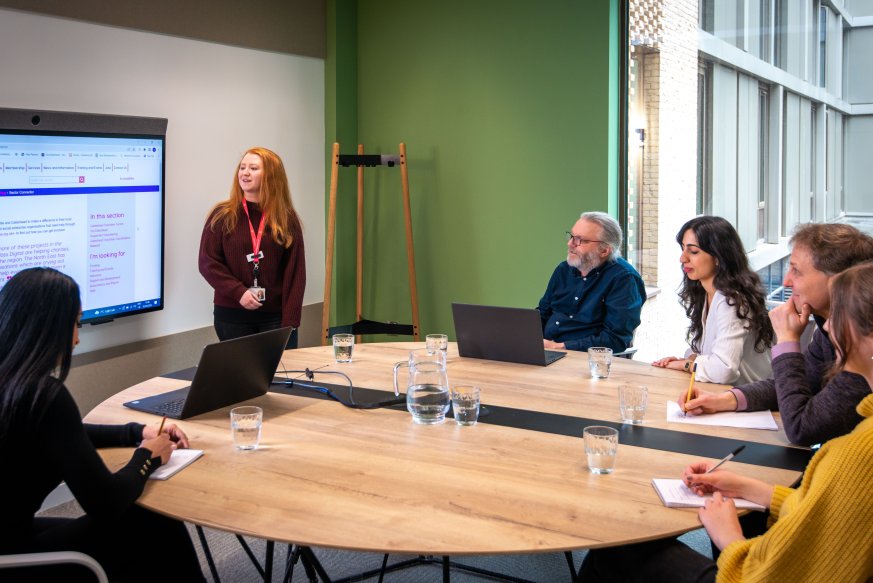 Group of people sat around a table