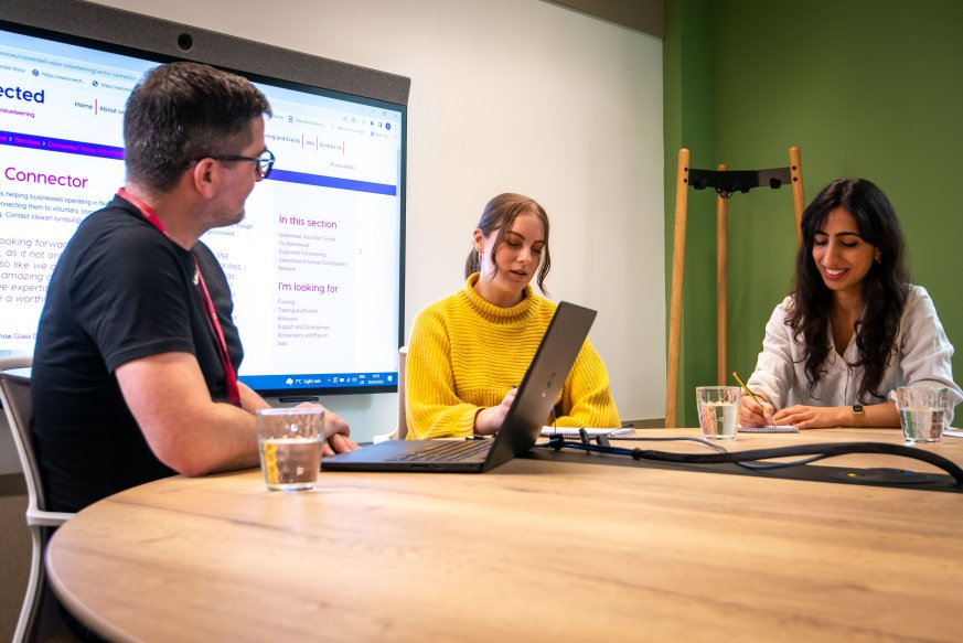 Group of people sat around a table