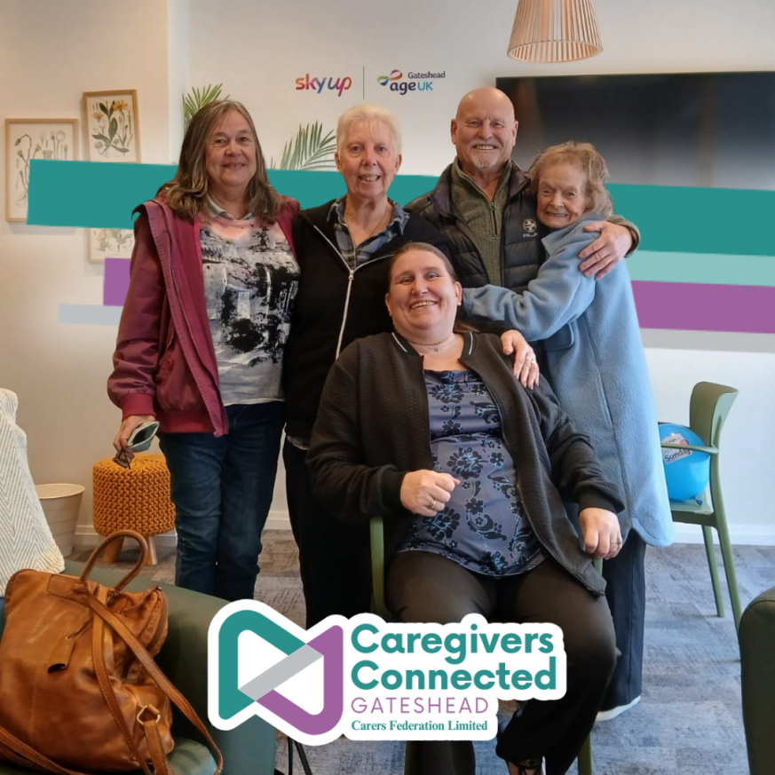 Group of caregivers posing for a group photo at our coffee morning.