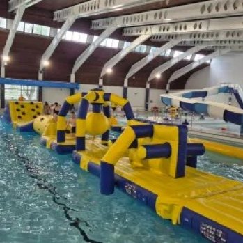 an inflatable obstacle course in a swimming pool