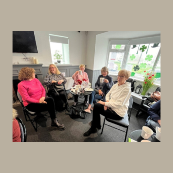 women talking to each other over a cuppa