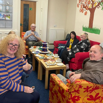 Photograph of a group of people enjoying the carer cafe session.