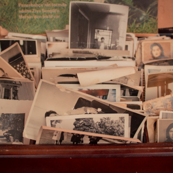 A photo showing a display of various old photos from different time periods.