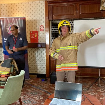 Photograph of a fireman delivering a presentation 