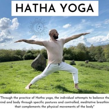 Man doing yoga pose in field