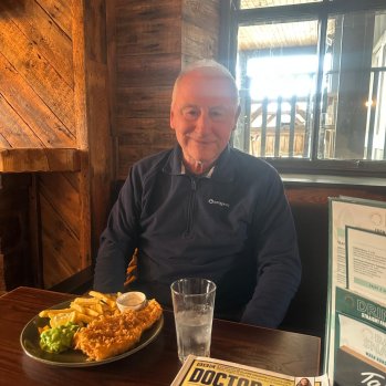 A picture of one of our clients enjoying a rare pub lunch on a day trip out.