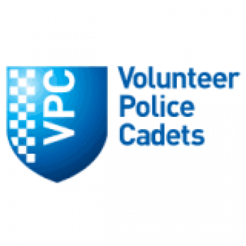 A blue shiled with the initials V P C. on the right are the words Volunteer Police Cadets 