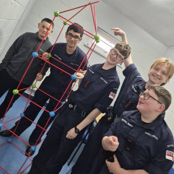 Photo of Sea Cadets with a completed STEM team building activity