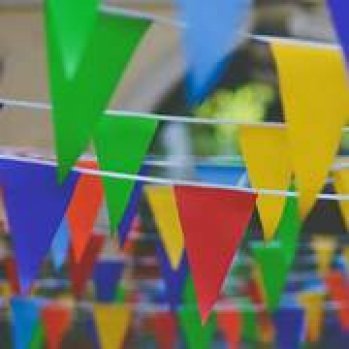 Multicoloured bunting hanging in rows.