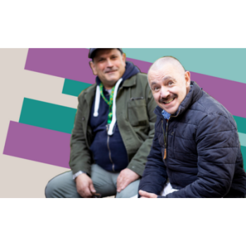 Photograph of two men enjoying each others company.