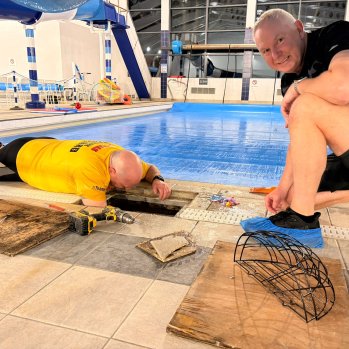 Volunteers doing work around the pool