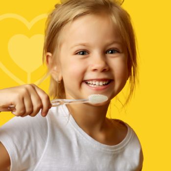 a young girl brushing her teeth 