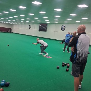 Group of people playing Bowls